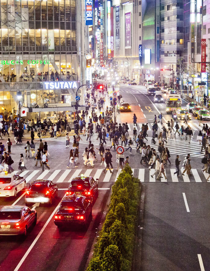 Busy street with people crossing the road