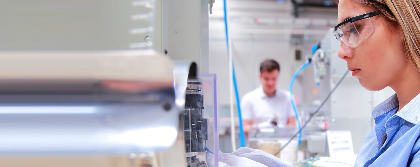 Person out of focus in background of a lab