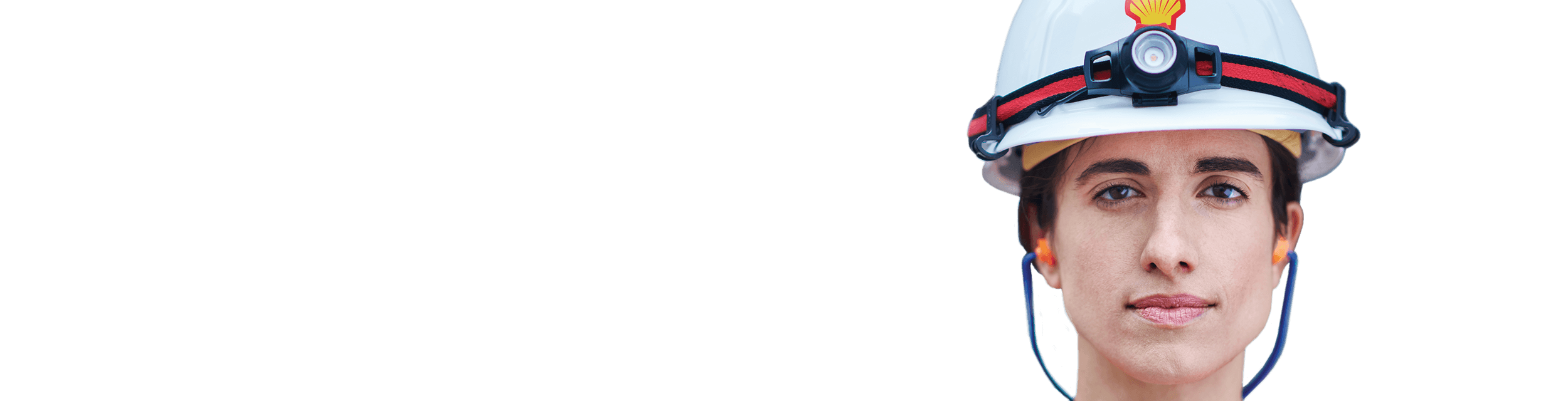 Person wearing hard hat and jacket in foreground